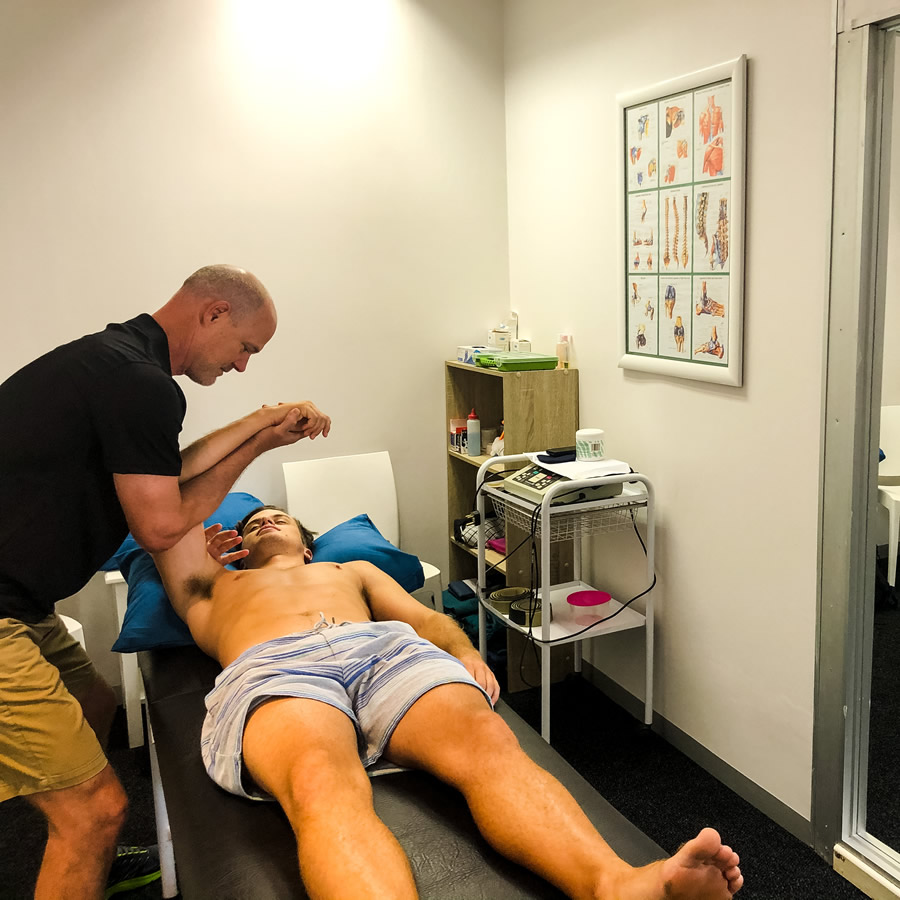 Physiotherapist performing manual therapy at Brookwood Physio